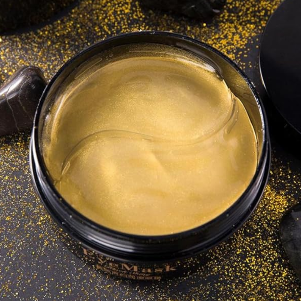 24k gold eye mask in a black pot.